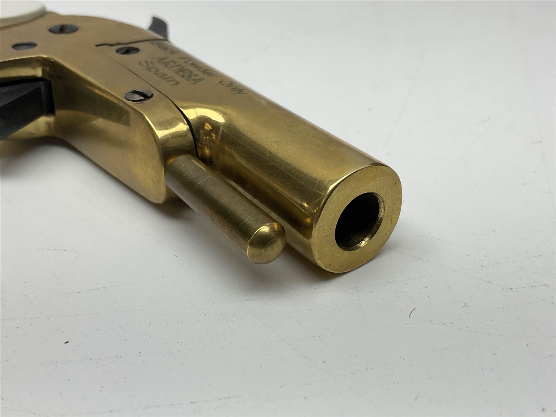 SECTION 1 FIRE-ARMS CERTIFICATE REQUIRED - Spanish Ardesa percussion vest pocket Derringer pistol, .31 cal. black powder; single shot; 6cm barrel; all brass body with white grips; no.14-13-013682-10 with Spanish certificate dated 2010 and box of one hundred balls