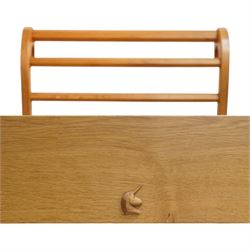Unicornman - pair of craftsman-made oak single beds, of sleigh shape with scrolled head and foot-boards with octagonal stretchers, slatted base, raised on inward-splayed squared supports, applied with carved unicorn signature, by Geoff Gell of Coxwold