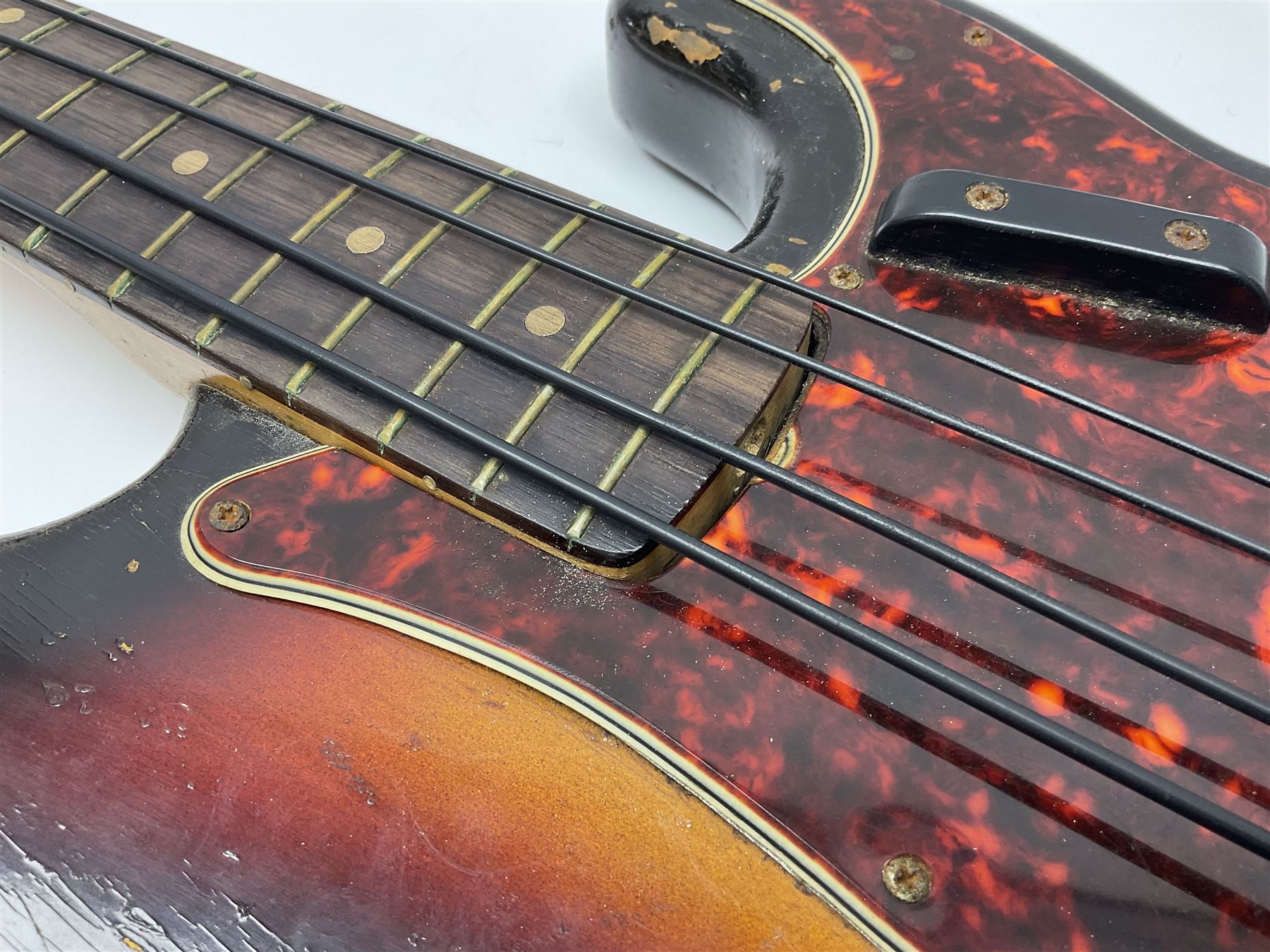 Early 1960s American Fender Precision electric bass guitar with original three-tone sunburst finish and faux tortoiseshell scratch plate; rosewood fretboard; all original fittings including chromium plated bridge and pick-up covers, finger rest, 'pots' and machines, dated on end of neck 5NOV62C, serial no.91625; L115cm overall; in Selmer simulated reptile skin covered carrying case. Sold with non-transferrable CITES A10 licence, certificate no.23GBA10CNKKEB, serial no.441200, dated 30th August 2023. Also included are original 1960s photographs of the band 'The Rascals' and photocopies of newspaper cuttings advertising their forthcoming performances along with a photocopy of a photograph of their television appearance on 'Opportunity Knocks' in 1967/8 (coming second to Mary Hopkins). In addition there is a reel-to-reel tape recording and USB stick of the band playing and two sheets of biographical information. Auctioneer's Note: The guitar was ordered by Trevor Parker from Pat Cornell's Music Shop, Spring Bank, Hull and imported from the USA in 1962, well before it was available in the UK. Trevor was the bass guitarist of The Rascals from Hull, later The Ides of March, who supported artists such as Elton John on the Hull circuit. Trevor played the guitar extensively until 1969 when The Rascals disbanded, he got married to Maureen and settled down to family life. Trevor sadly passed away in 2017, and after being in store for fifty-four years his widow has decided it is time for his guitar to be sold.