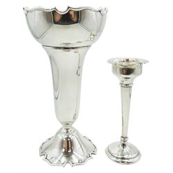 1920's silver vase, of tapering cylindrical form, the spreading rim and filled base with Monteith style castellated edge, hallmarked Stokes & Ireland Ltd, Chester 1926, H20cm, together with a smaller silver filled specimen vase with lobed rim, hallmarked Clark & Sewell, Birmingham 1910, H13.5cm, (2)