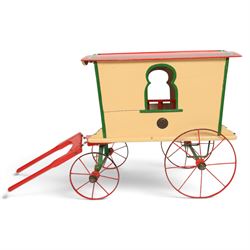 G & J Lines wooden gypsy caravan model, painted in cream with red roof, wheels and green detailing, H51cm, L89cm