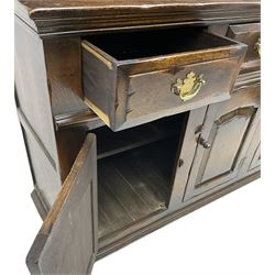 Georgian design oak dresser, the two-tier plate rack with two flanking spice cupboards, the base fitted with three drawers over three arched fielded panelled cupboards, lower moulded edge on block feet