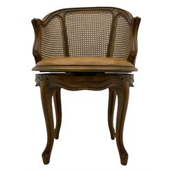 Louis XV style bergère and beech framed swivel desk chair, with brown leather upholstered seat, on four cabriole supports