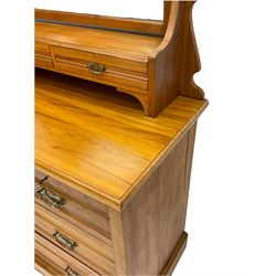 Late 19th century satin walnut dressing chest, rectangular bevelled swing mirror with two small trinket drawers, the chest fitted with two short and two long drawers, plinth base