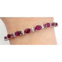 18ct white gold oval ruby and diamond bracelet, hallmarked, total ruby weight 11.00 carat, total diamond weight approx 1.20 carat