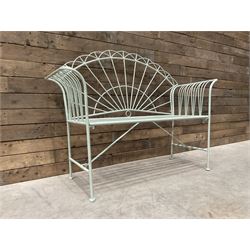 Wrought metal two seat garden bench, sunburst back, painted in pale green finish