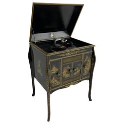 Early 20th century Chinoiserie lacquered gramophone cabinet, the lid decorated with raised gilt work, traditional landscape and figural scenes, fitted with 'Apollo' 'No. 114' gramophone, cupboards below, on cabriole supports
