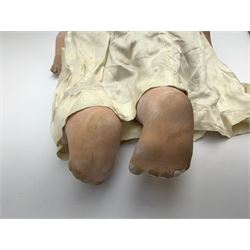 Seyfarth & Reinhardt composition head baby doll with moulded hair, sleeping flirty eyes, open mouth with one tooth and tongue and soft body with composition jointed limbs, marked 'SuR Germany 30/5' H47cm; together with a Golborne Dolls 'Golborne Beauty' composition head and body bride doll, marked 'F.P.23' in original box H63cm (2)