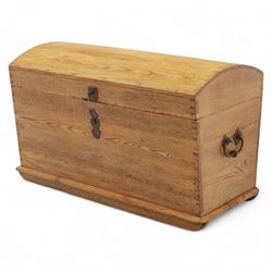 Early 20th century pine coffer, domed lid over plain front and sides with exposed dovetail joints, iron hasp and staple to front