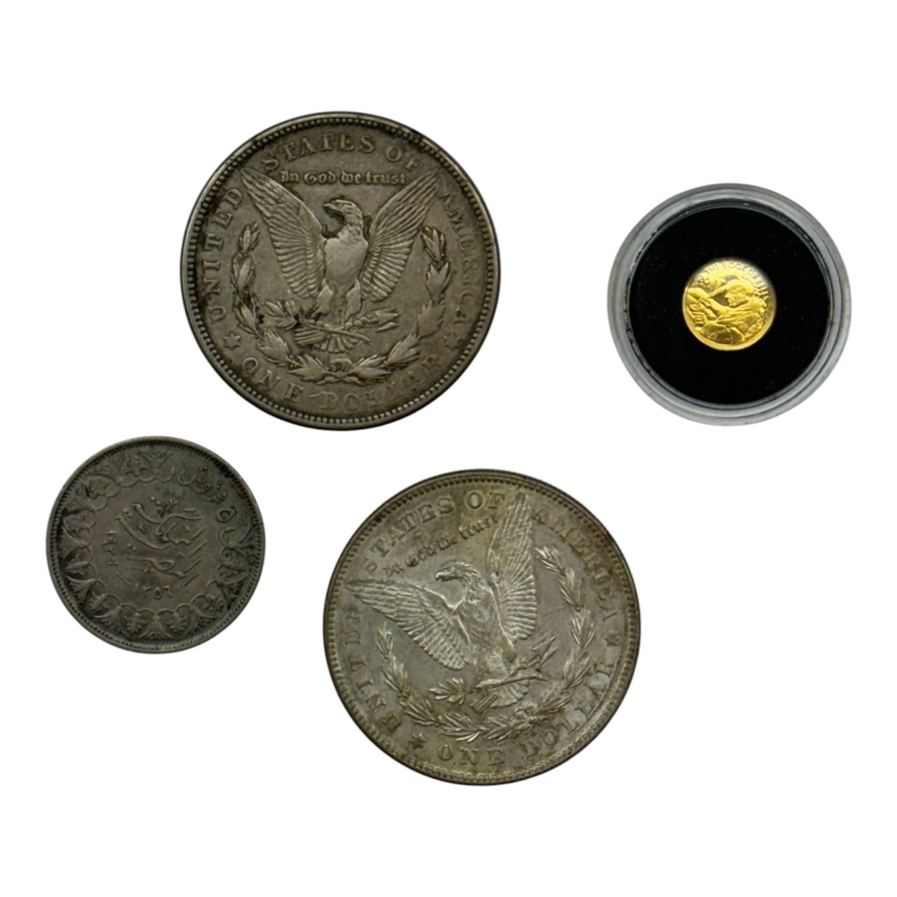 Irish 2012 'Book Of Kells' twenty euro miniature gold coin, 1878 S and 1921 S silver Morgan dollar and an Egyptian silver coin (4)