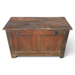 18th century oak coffer with carved frieze and rails, rectangular plank top with iron strap hinges, raised on stile supports
