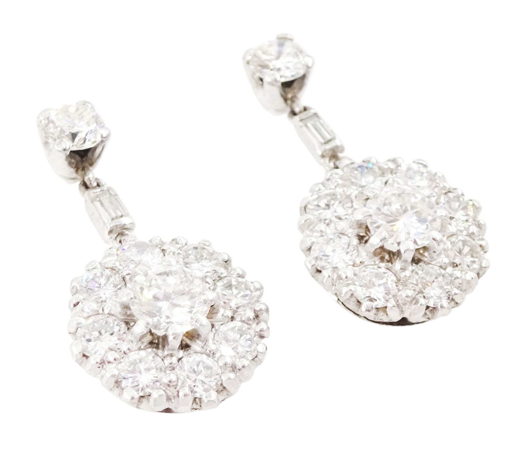 Pair of 18ct white gold diamond cluster pendant stud earrings, cluster of round brilliant cut diamonds, suspending from a single baguette cut diamond a further round brilliant cut diamond, total diamond weight approx 1.70 carat