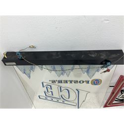 Electric neon Budweiser advertising sign, together with a Foster's example etc