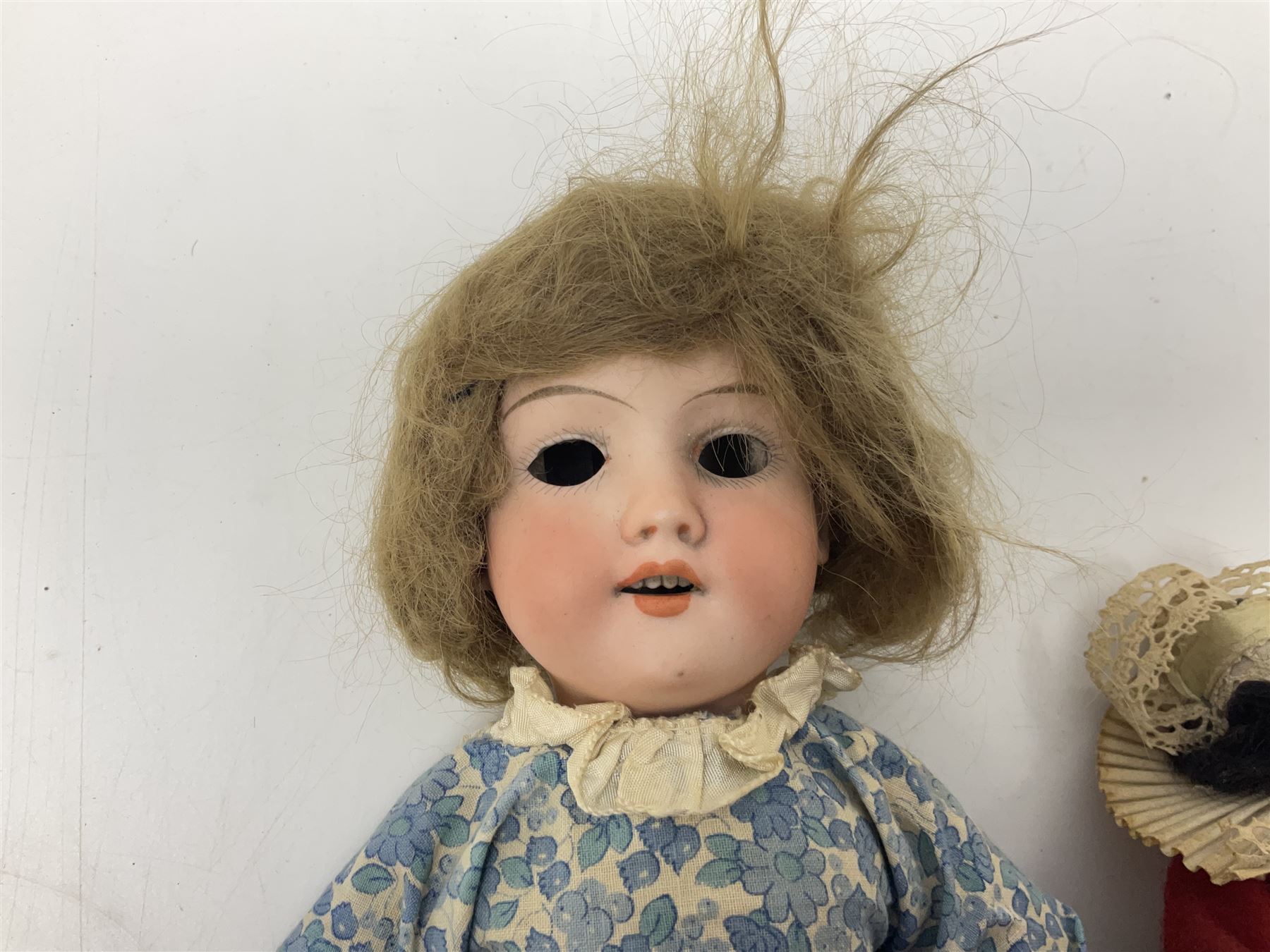 Armand Marseille Koppelsdorf composition head doll with applied hair, sleeping eyes, open mouth with teeth and tongue and composition body with jointed limbs, marked 'AM Koppelsdorf 970 Germany A.7.M' H55cm; Armand Marseille bisque head doll with applied hair, open mouth with teeth and composition body with jointed limbs, marked 'Armand Marseille 390n DRGM 246/1 A3/0M'; Fleur de Genet costume doll; and quantity of 1930s doll's house furniture