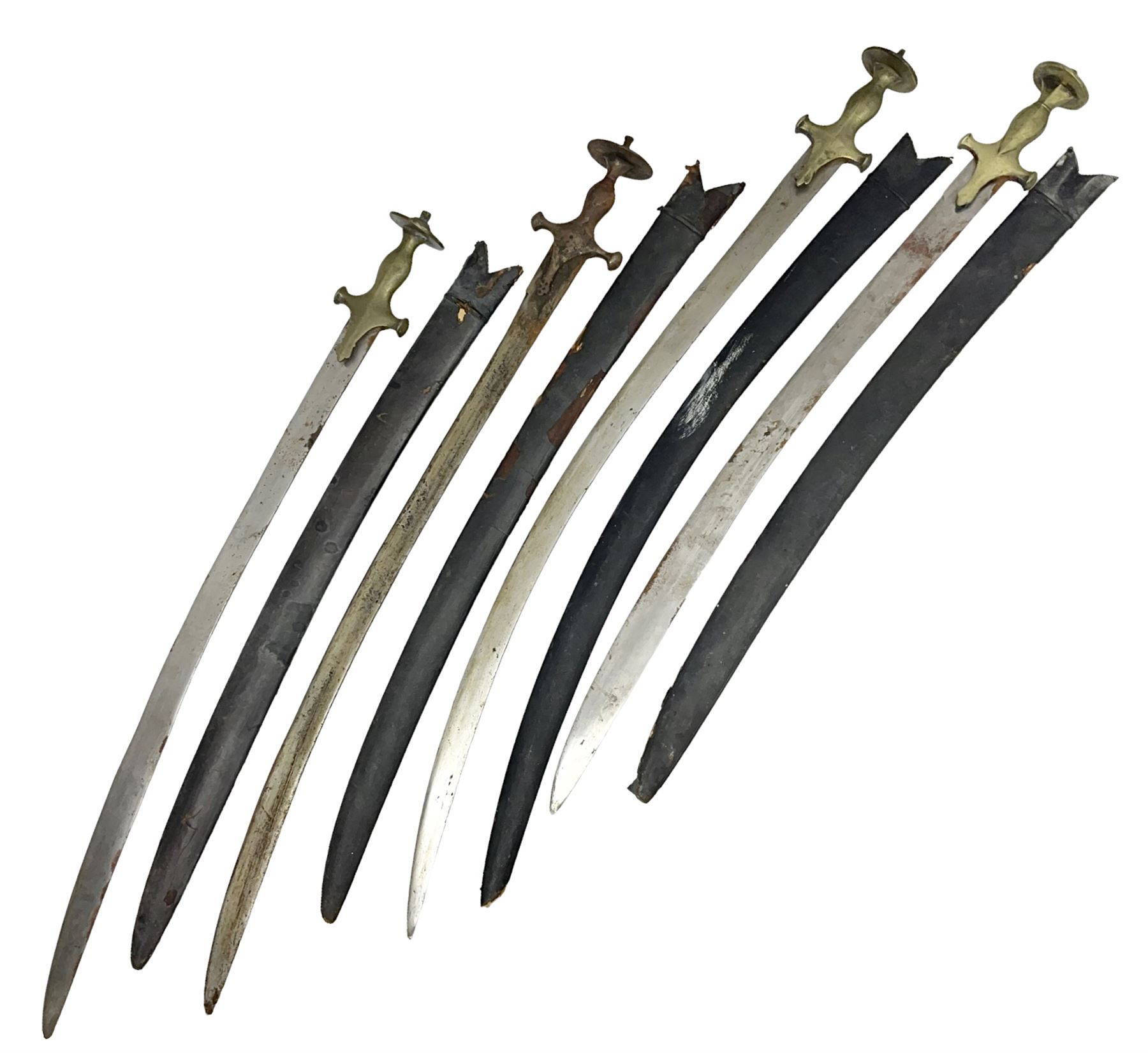 Four Indian tulwar swords; three with cast brass hilts and one with iron hilt; longest blade 81cm; all with scabbards (4)