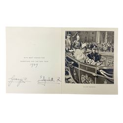 King George VI and Queen Elizabeth - signed 1949 Christmas card with gilt embossed crown to cover, black and white photograph to the interior, of The King and Queen riding in an open carriage to their Silver Wedding Celebration, signed 'George R. Elizabeth R.'