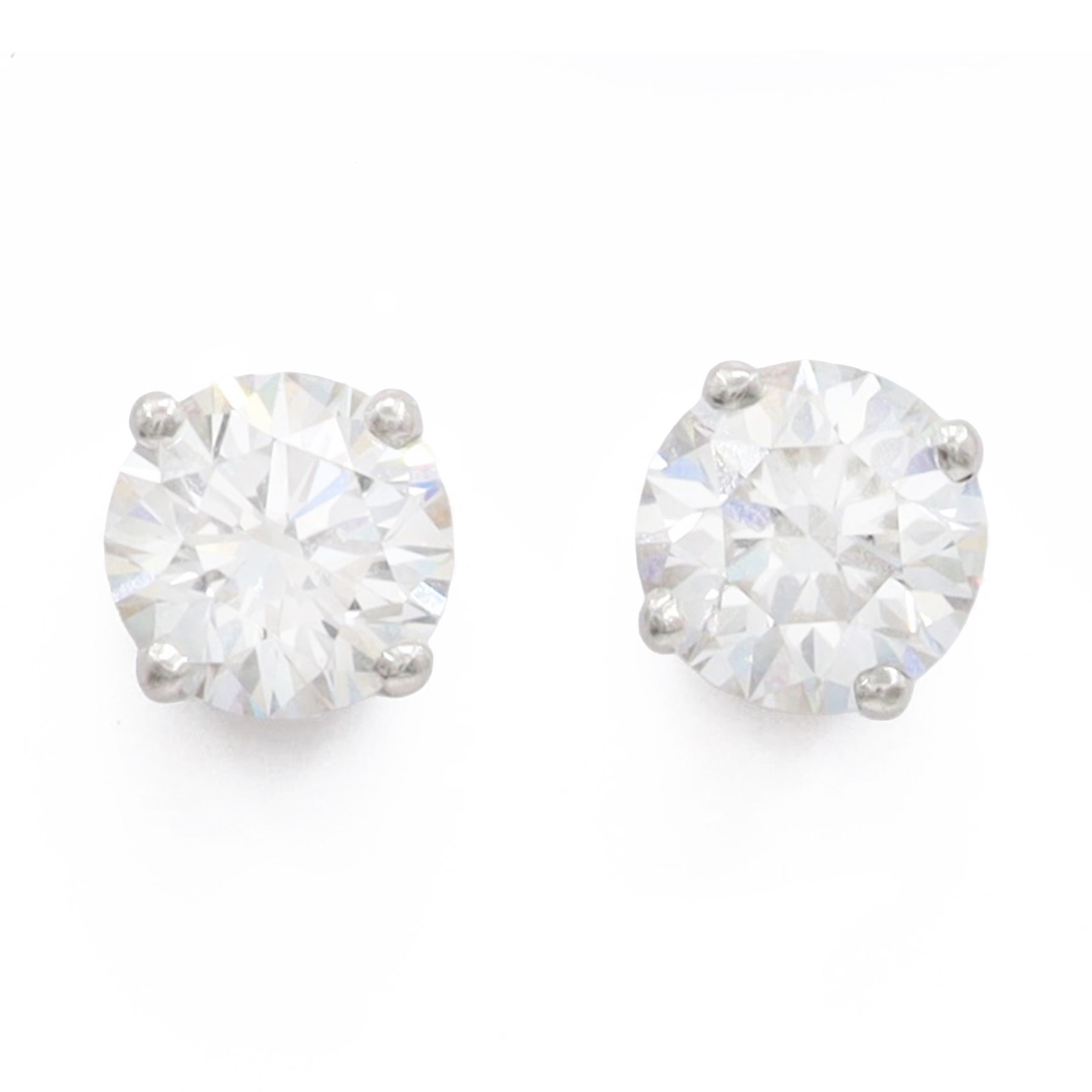 Pair of platinum diamond earrings, each stud set with a single round brilliant cit diamond, hallmarked, total diamond weight approx 1.50 carat
