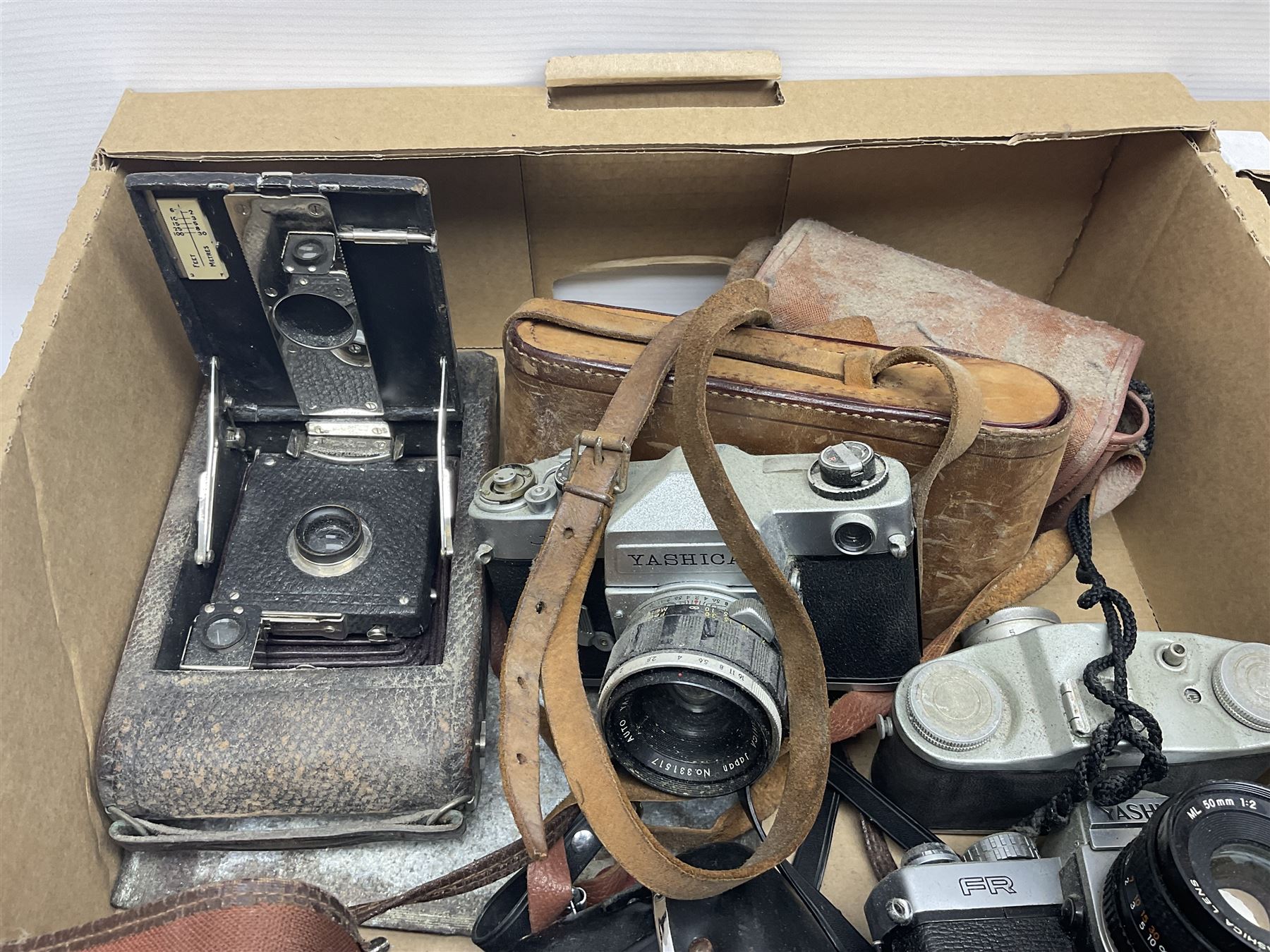 Large collection of cameras to include folding and SLR examples, including Rank Aldis, Agfa, Yashica, etc