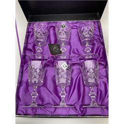 A cased set of six Edinburgh lead crystal drinking glasses, with cut bucket bowls, H14cm, together with a pair of straight sided cut glass decanters with stoppers, and a further decanter with part hobnail cut decoration and mushroom stopper. 