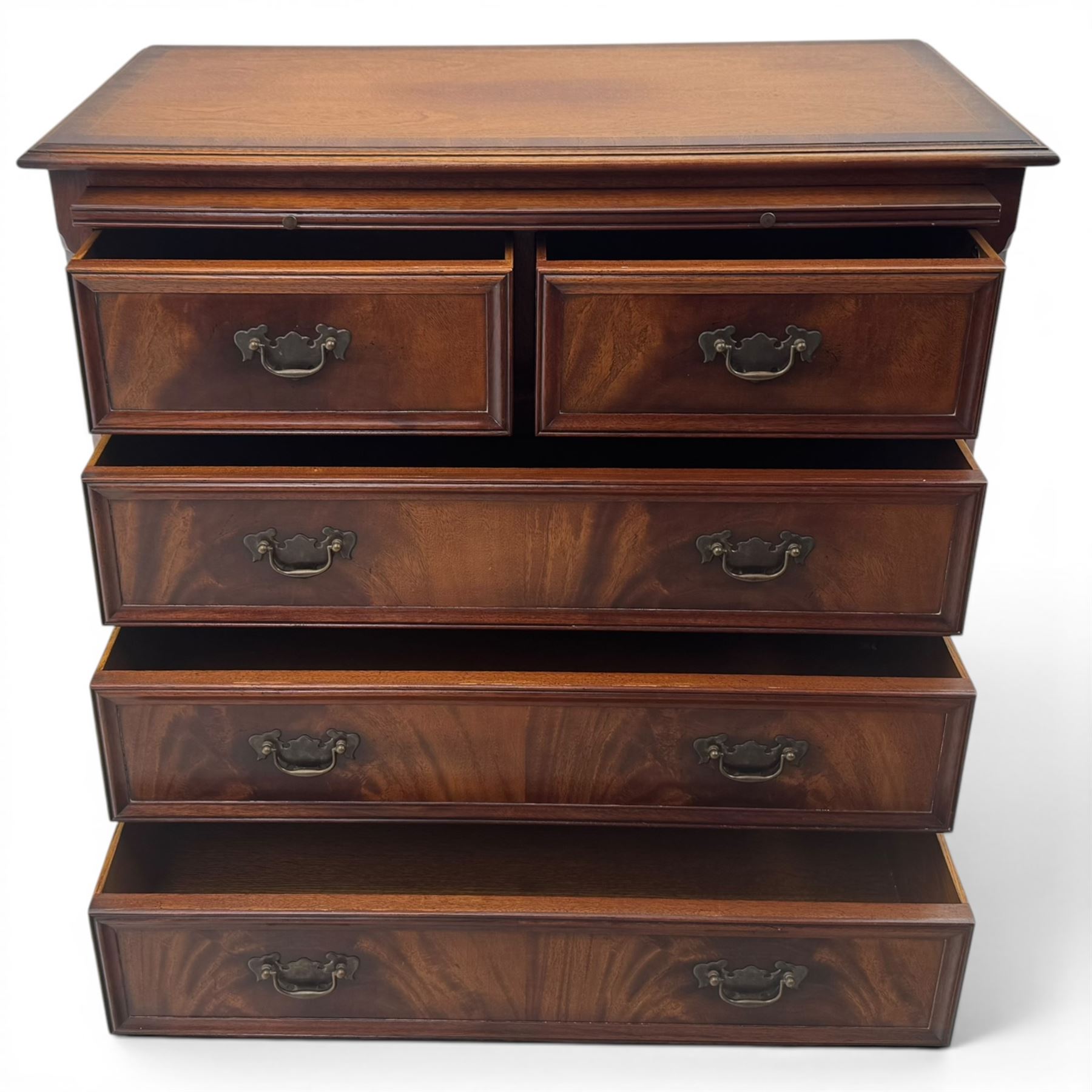 Charles Barr - mahogany bachelor's chest, with brushing slide two short over three long drawers with moulded edges, shaped apron raised on bracket feet