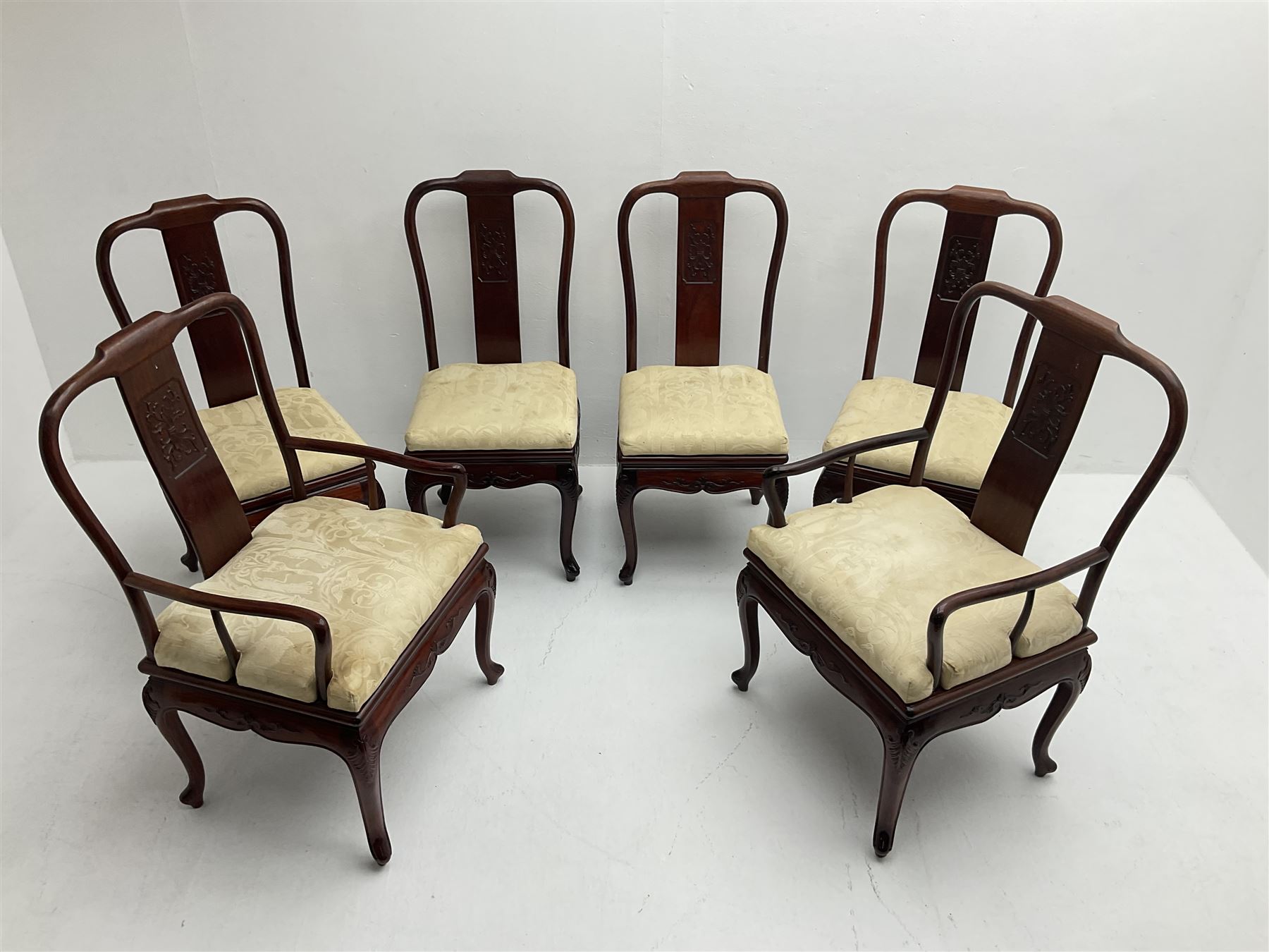 Mid to late 20th century Chinese hardwood extending dining table, two additional leaves, shaped apron carved with foliate scrolls, leaf carved cabriole supports (W246cm, H78cm, D117cm), and set six (4+2) dining chairs with shaped cresting rails over carved splats