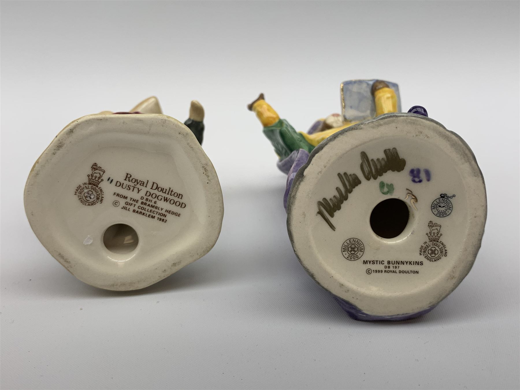 A Beswick Arab Xayal Connoisseur Horse in matt brown, upon a wooden base, together with two Royal Doulton figures, Mystic Bunnykins, and Dusty Dogwood. (3). 