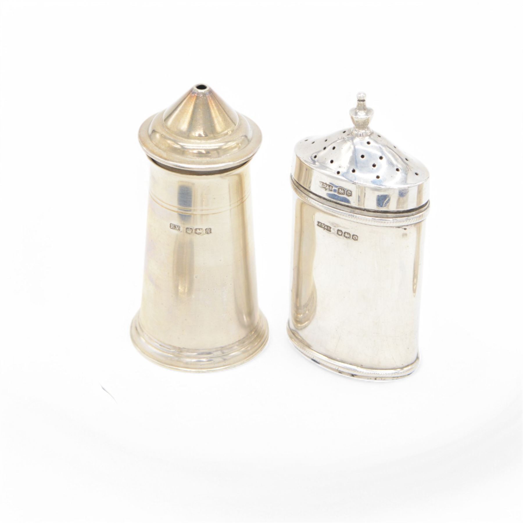 Group of silver cruet items, comprising pair of Art Deco salt and pepper shakers, of tapering cylindrical form, hallmarked Viner's Ltd, Sheffield 1933, pair of silver open salts, pair of salt shaker, and a matching pepper shaker and open salt, all hallmarked