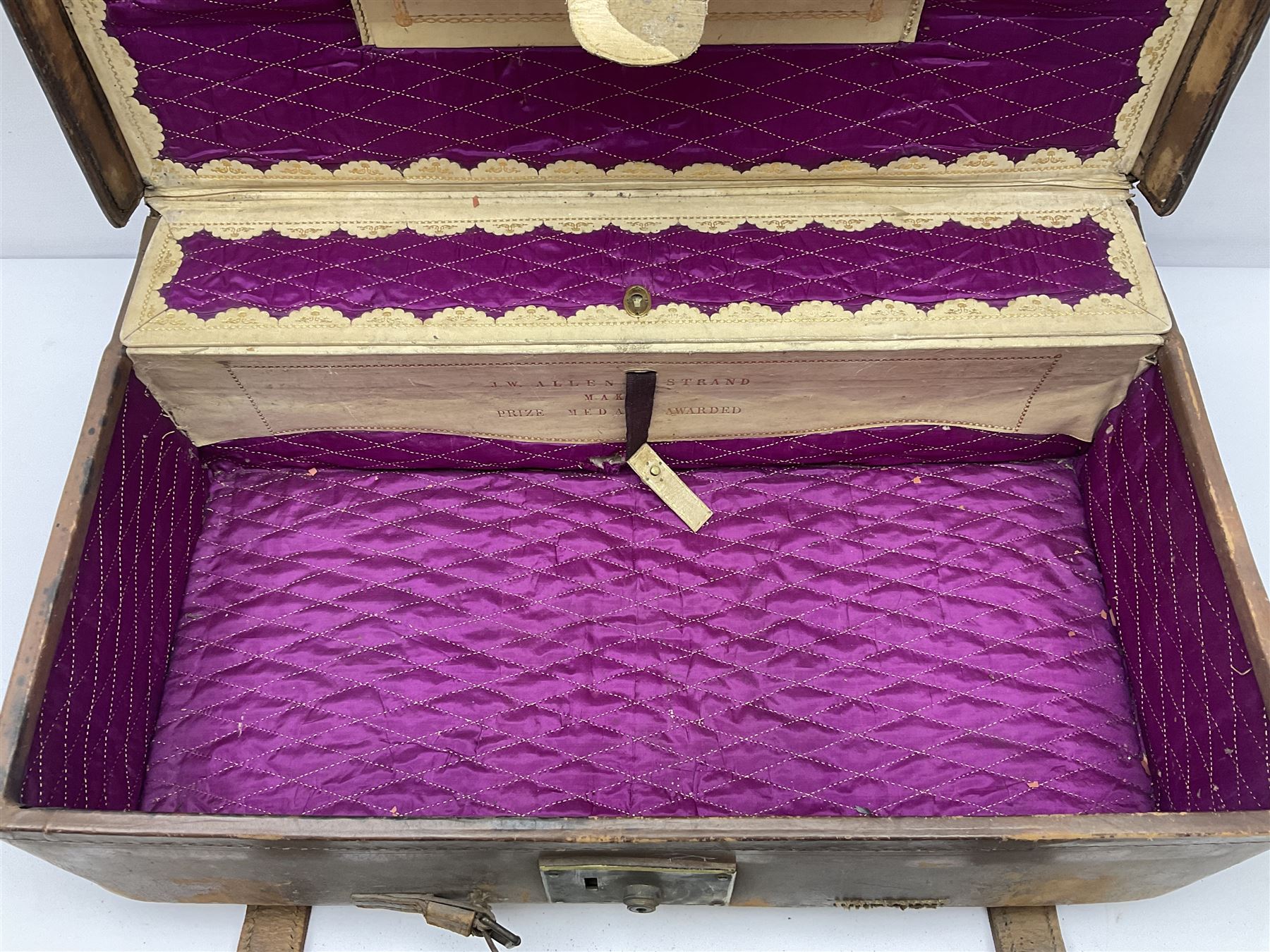 19th century leather suitcase, with brass plaque to cover engraved 'C R F Lutwidge Esq', the pink silk and white kid leather interior with pouch and edging impressed with gilt lettering reading 'By Appointment of Prince of Wales J W Allen 37 Strand Maker Prize Medal Awarded', H21cm, W73cm, Notes: Charles R. Fletcher Lutwidge, was mayor of Tunbridge Wells between 1895-1898, and again between 1901-1902