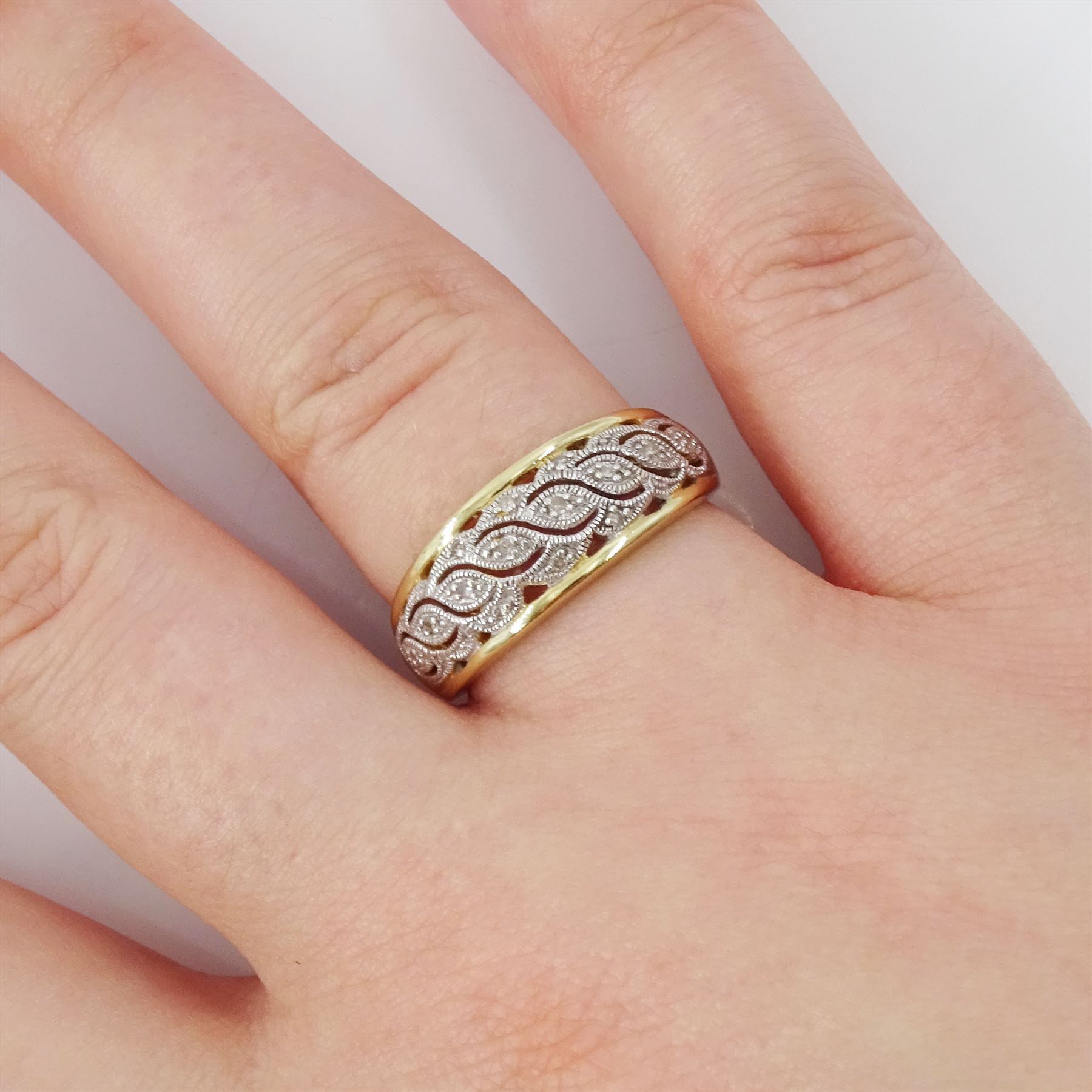 9ct gold diamond ring, milgrain set diamond chips, in a fancy openwork setting, hallmarked