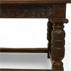 17th century revival oak refectory table, rectangular plank top above a scallop shell carved frieze and baluster turned legs carved with scallop shell and Gothic tracery, joined by stretchers