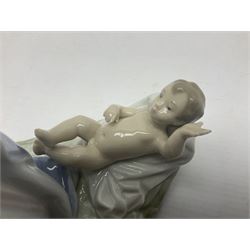 Lladro figure, Holy Night, modelled as Mary kneeling over baby Jesus, sculpted by Vincente Martinez, with original box, no 5796, year issued 1991, year retired 1994, H22cm