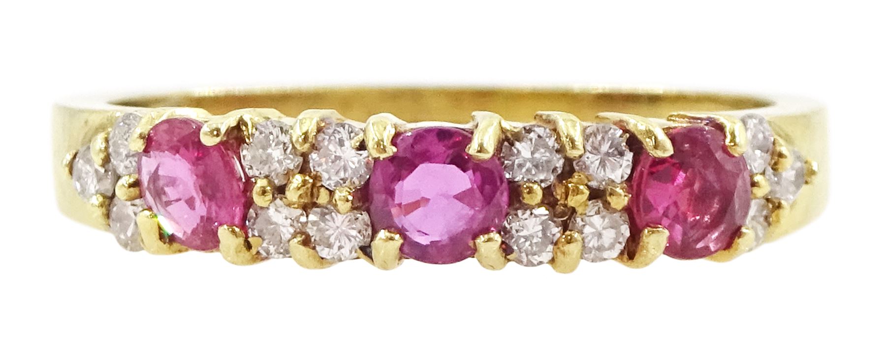 18ct gold three stone round cut ruby and round brilliant cut diamond ring, London 1991