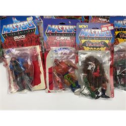 Thirty-one Masters of the Universe He-Man figures re-bagged on original backing cards;  two others lacking backing cards; boxed Modulok figure; bag of weapons and accessories; Roton, two horses and two battle cats; 1986 & 1987 Annuals; Ladybird and other story books; Panini sticker album; instructions etc
