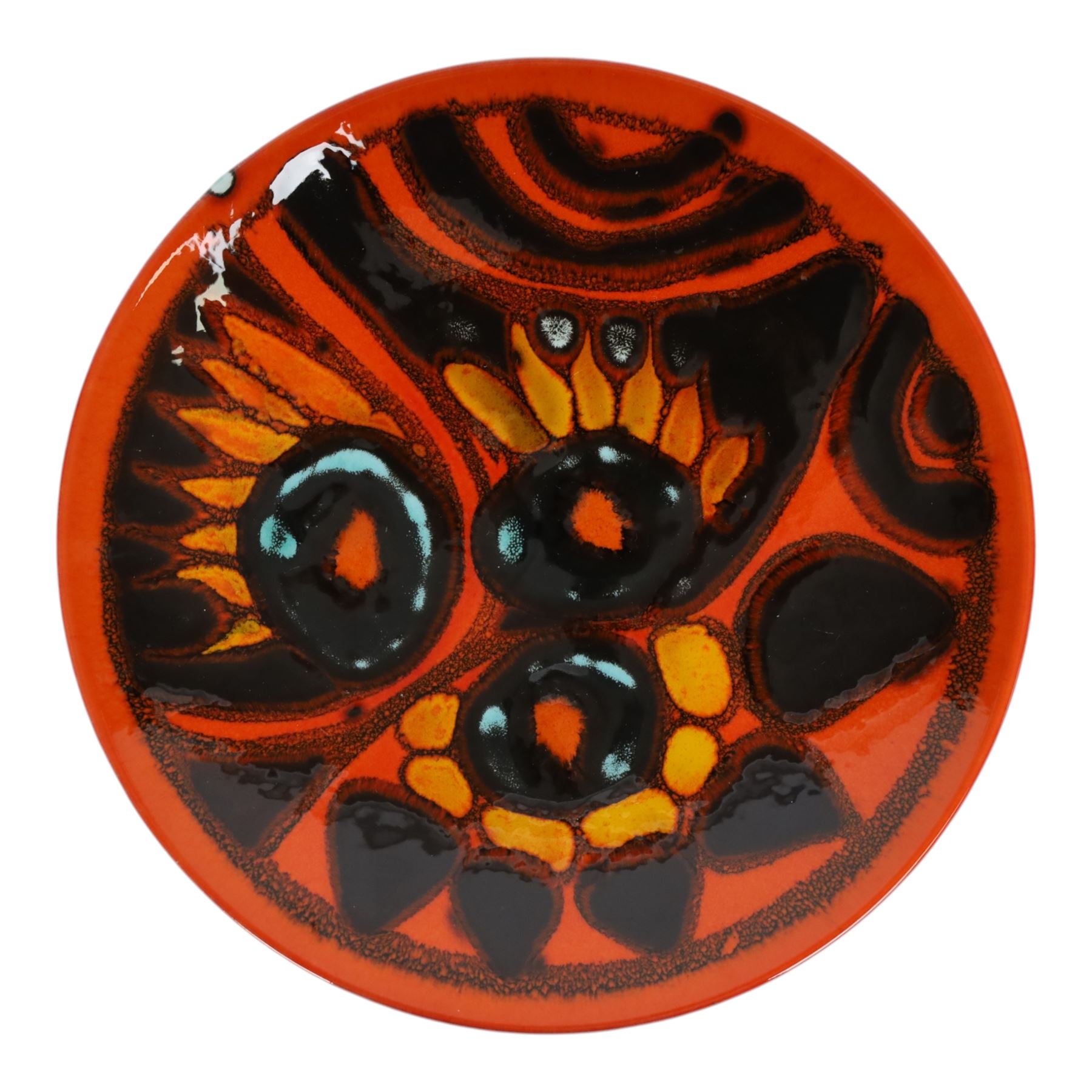 Poole pottery, Delphis Volcano pedestal dish, Delphis charges, in blues and black on a red ground, shape four and another plate, pedestal dish D23cm 