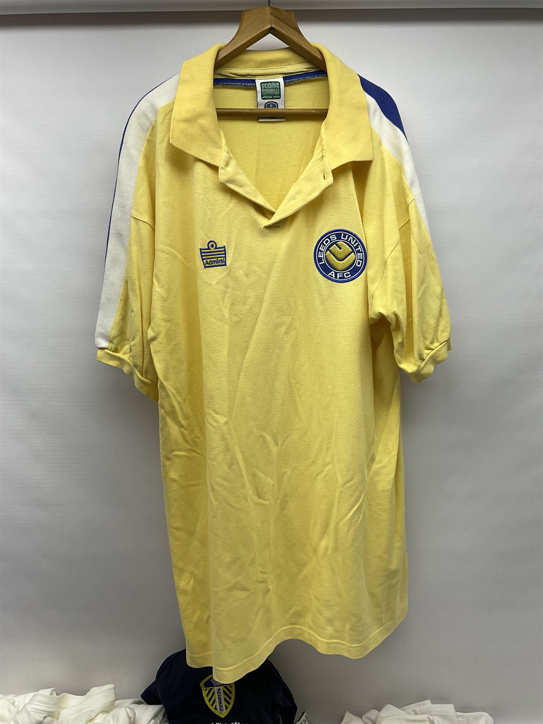 Fourteen items of replica sporting clothing including Leeds United football club shirts, England jerseys etc