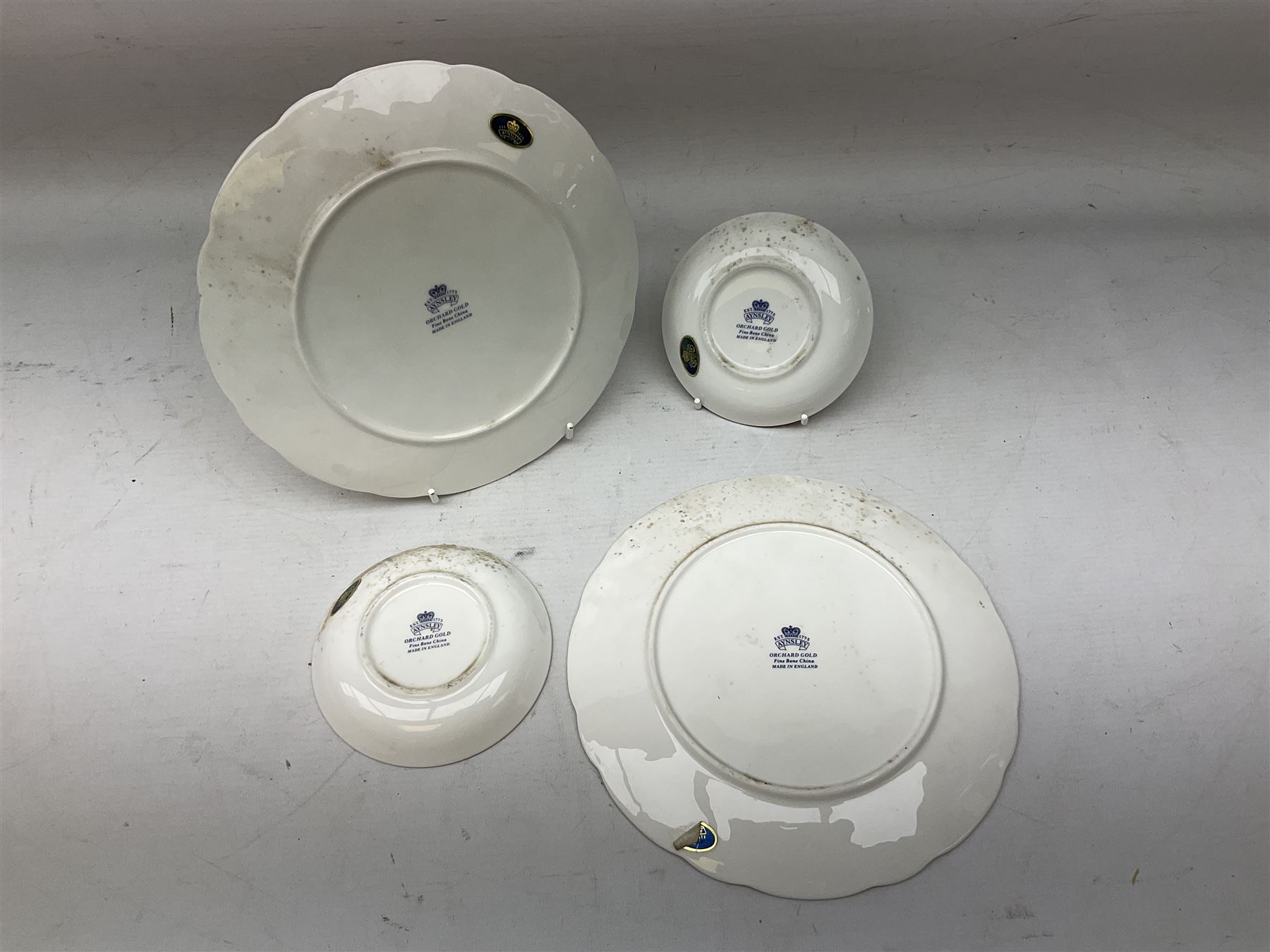 Two Aynsley Orchard Gold pattern plates and two trinket dishes, plates D20.5cm