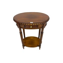 Oval mahogany side or lamp table, gadroon moulded top over single drawer and undertier, turned and reed carved supports 