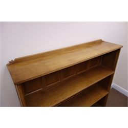  Bob 'Wrenman' Hunter oak bookcase, adzed top with raised back carved with signature Wren, two shelves with panelled back and sides on a stepped skirted base, W125cm, D30cm, H128cm  
