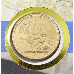 Queen Elizabeth II 2000 gold full sovereign coin, housed in a commemorative cover