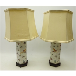 Pair Chinese Famille Rose hexagonal table lamps each decorated with butterflies on hardwood stands, H29cm   