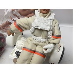 Action Man - large collection of 1960s and later figures and accessories including Spaceman with ATLRV vehicle; two figures marked 'Made in England by Palitoy under licence from Hasbro 1964'; twenty-five assorted weapons; radio backpacks; kit bags; twenty-one pairs of boots; football boots and snow shoes; metal diver's boots and three pairs of flippers; two pairs of jackboots; roller skates; various tunics, trousers, flying suits, jumpers, belts etc; twenty helmets, berets, busby, kepis, submariner etc; and quantity of other accessories