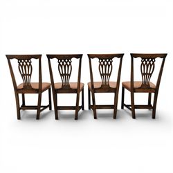 Set of eight George III dining chairs with padded seats, pierced vasiform splat, upholstered seat with brass trim, on square supports with H-stretcher