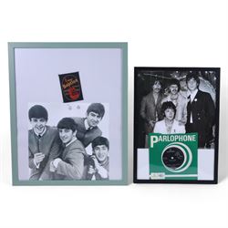 The Beatles memorabilia, including 1964 Fan Club patch, framed with a black and white picture of the band, a further framed black and white picture displayed with Strawberry Fields Forever single, The Beatles Anthology, biographies and other books, two CDs, mug, etc