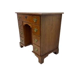 George III style mahogany kneehole desk, fitted with seven drawers and 'dog kennel' cupboard