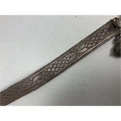 Omani Khanjar dagger, the 19cm curved blade with pronounced medial rib to either side, waisted hilt with dome shaped pommel and silver covered horn grip decorated with filigree bands, floral motifs and beadwork; in an intricately filigree decorated silver and leather scabbard with silver rings woven into the belt mount and fitted with original silver thread-work belt L34cm overall belt length 94cm