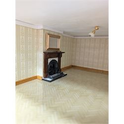 1:24 scale four-storey tudor-style dolls house, with black and white exterior, balcony garden, glazed panelled windows and wooden shingle roof, with decorated interior and wired fireplaces and lighting, H65cm, W58cm, D31cm, 