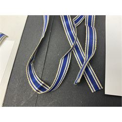 WWII set of three German Mother's Crosses, 1st Class in gilt, 2nd Class in silver and 3rd Class in bronze; all with ribbons (3)