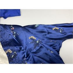 Chinese silk jacket, embroidered with floral sprigs on a deep blue ground, together with a Japanese silk kimono, embroidered with a gold peacock amongst flowers on a blue ground, a kangaroo fur purse and an ocelot fur evening bag