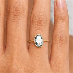 Early 20th century 18ct gold aquamarine ring, set with a single bezel set, oval cut aquamarine of approx 1.05 carat