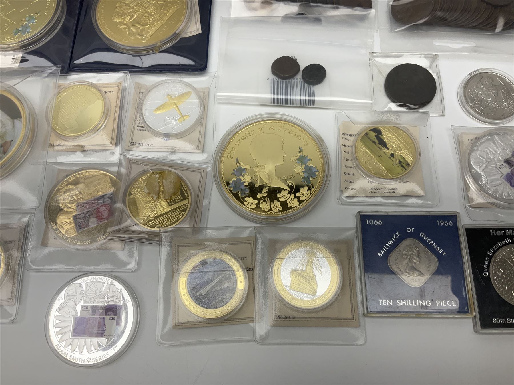 Mostly commemorative and fantasy coinage including commemorative crowns, 2018 'The Capsule Edition featuring the 2018 Paddington 50p coins' in display case, The Royal Mint Solomon Islands 2007 one ounce fine silver five dollars coin on card etc